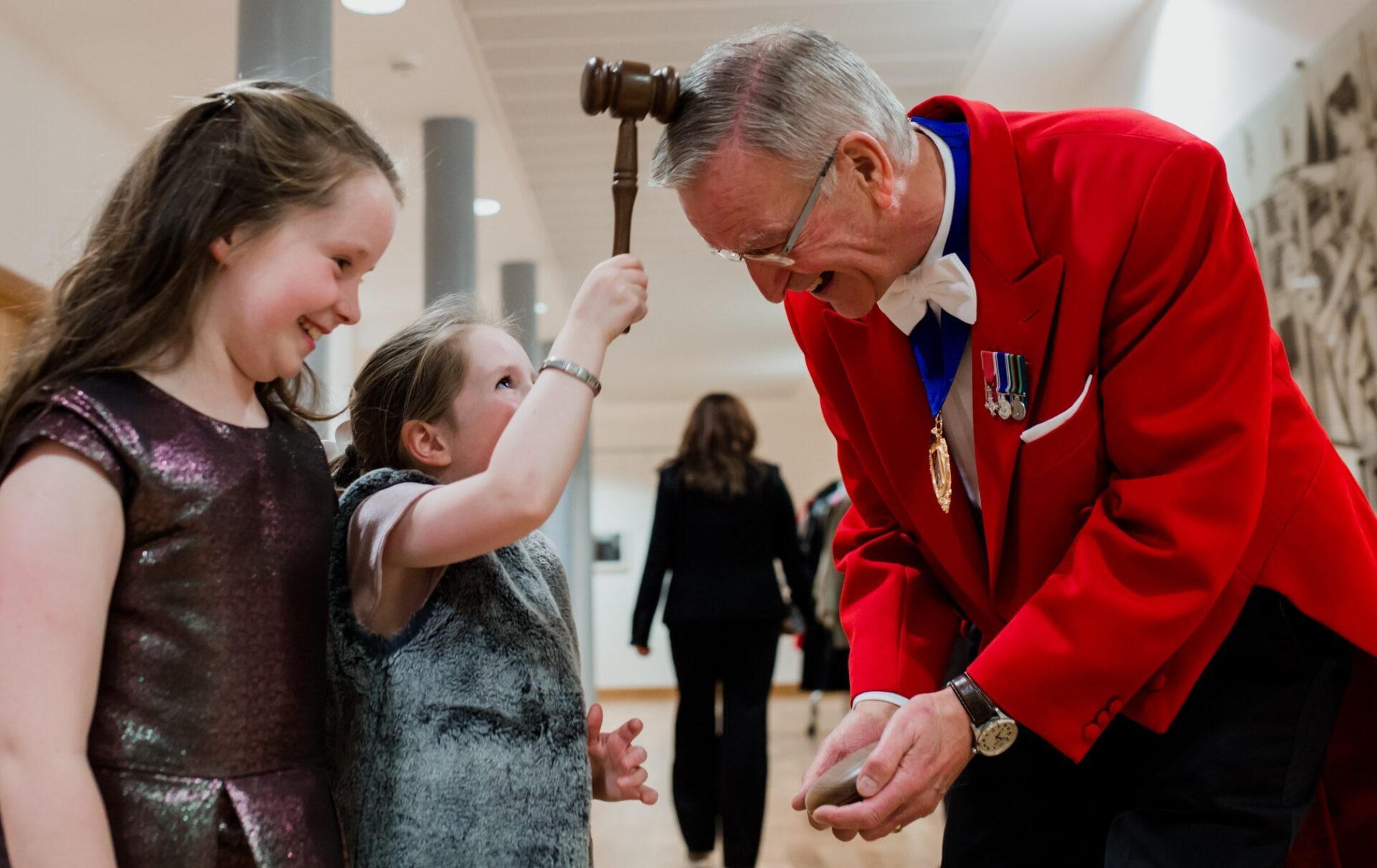 Contact the Professional Toastmasters' Guild -having fun with the children with gabble on head